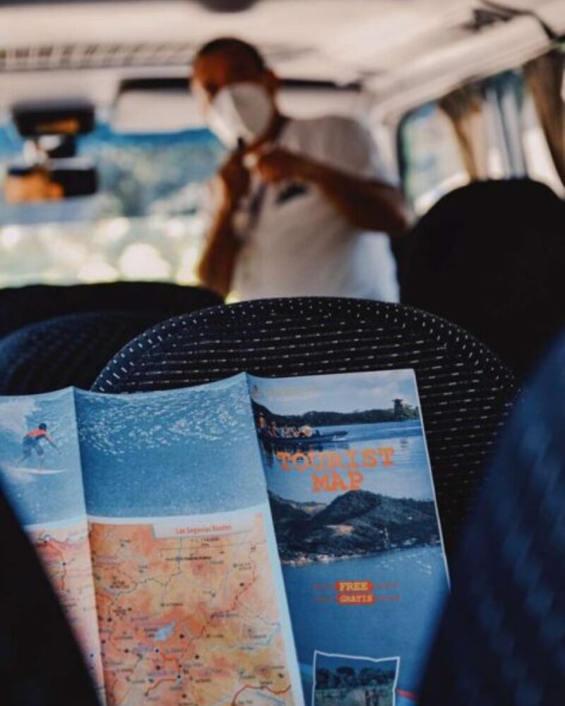 a person sitting in a vehicle with a map